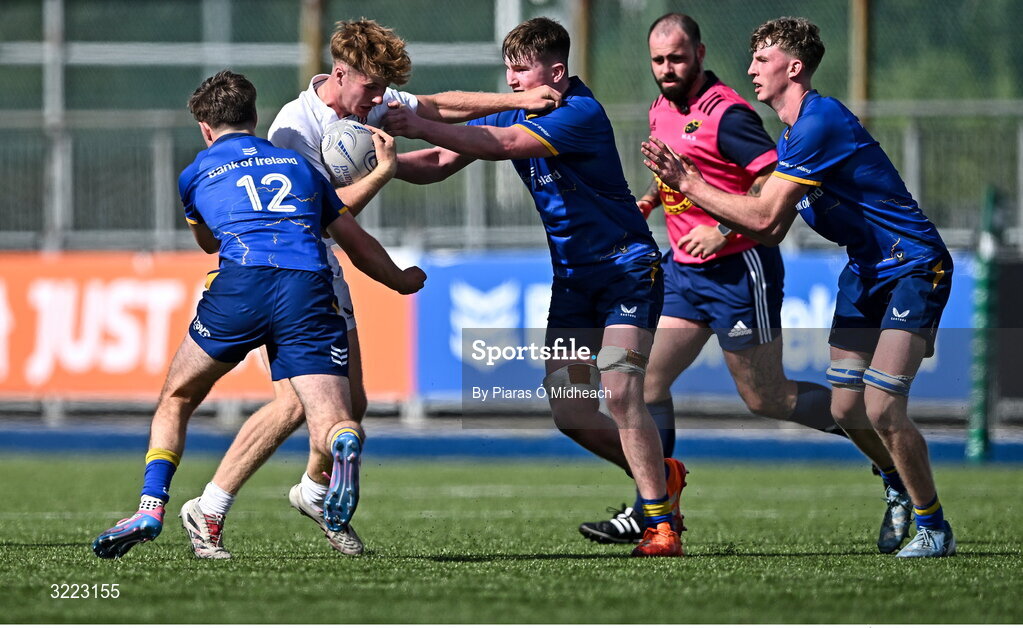27 August 2025; Oliver Gartley of Ulster in action against Tom Martin, 12, and Hugh Keaney  of Leinster during the PwC U-18 Boys Schools Interprovincial Series match between Leinster and Ulster at Energia Park in Dublin. Photo by Piaras Ó Mídheach/Sportsfile