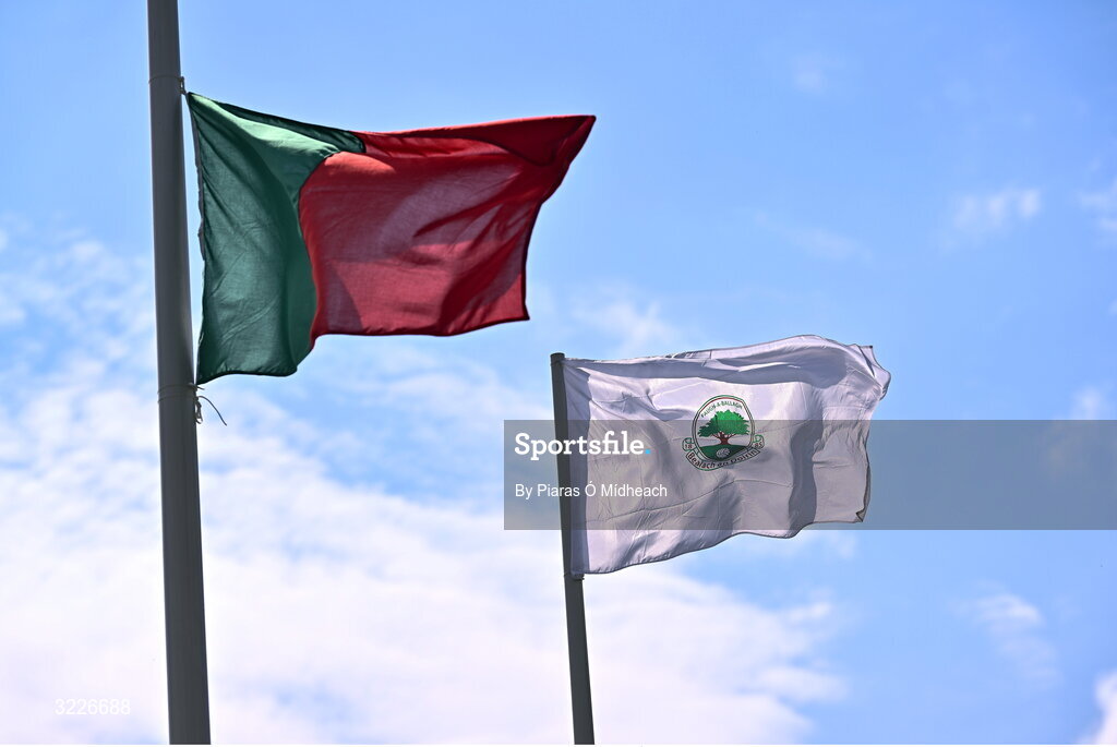 24 August 2025; The Ballaghaderreen flag, right, and the Mayo GAA flying before the Mayo County Senior Club Football Championship Round 2 match between Charlestown Sarsfields and Ballaghaderreen at Fr O'Hara Park in Charlestown, Mayo. Photo by Piaras Ó Mídheach/Sportsfile