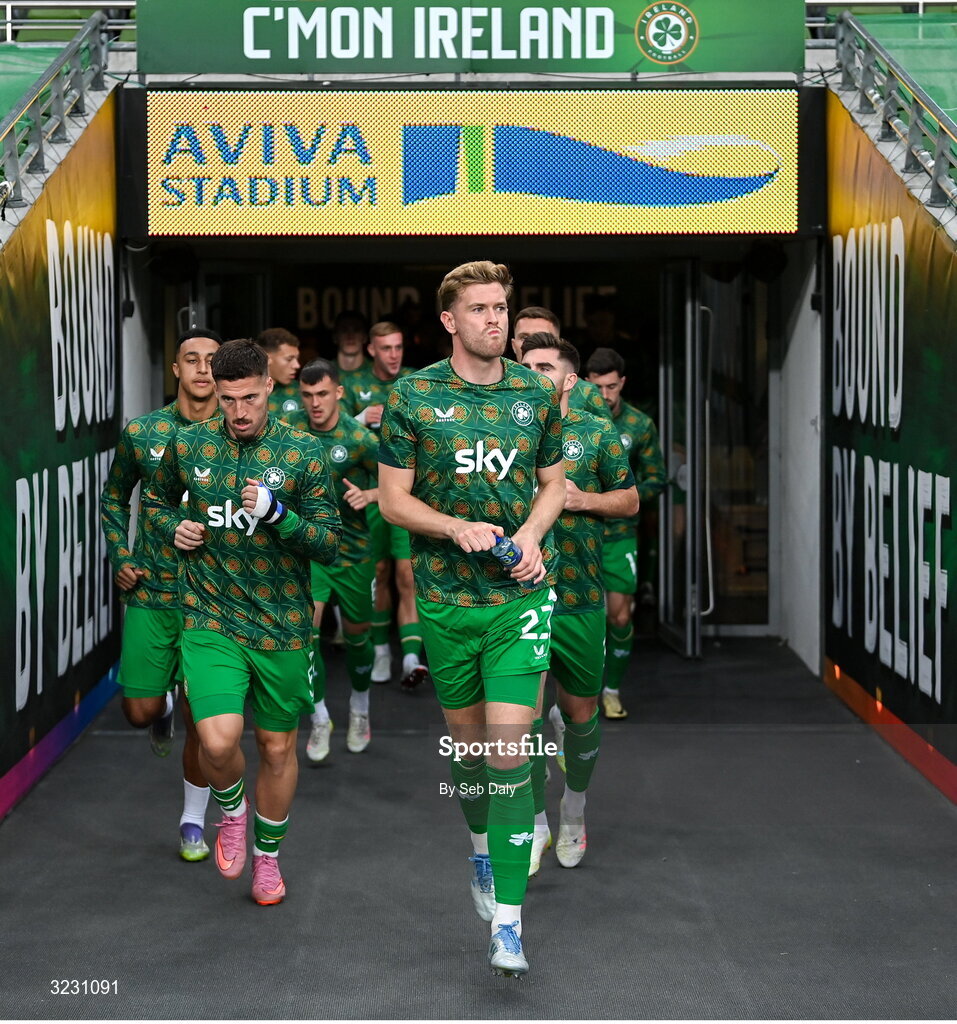 6 September 2025; Republic of Ireland captain Nathan Collins, centre, leads his team onto the pitch for the warm-up ahead of the FIFA World Cup 2026 Group F qualifying match between Republic of Ireland and Hungary at the Aviva Stadium in Dublin. Photo by Seb Daly/Sportsfile