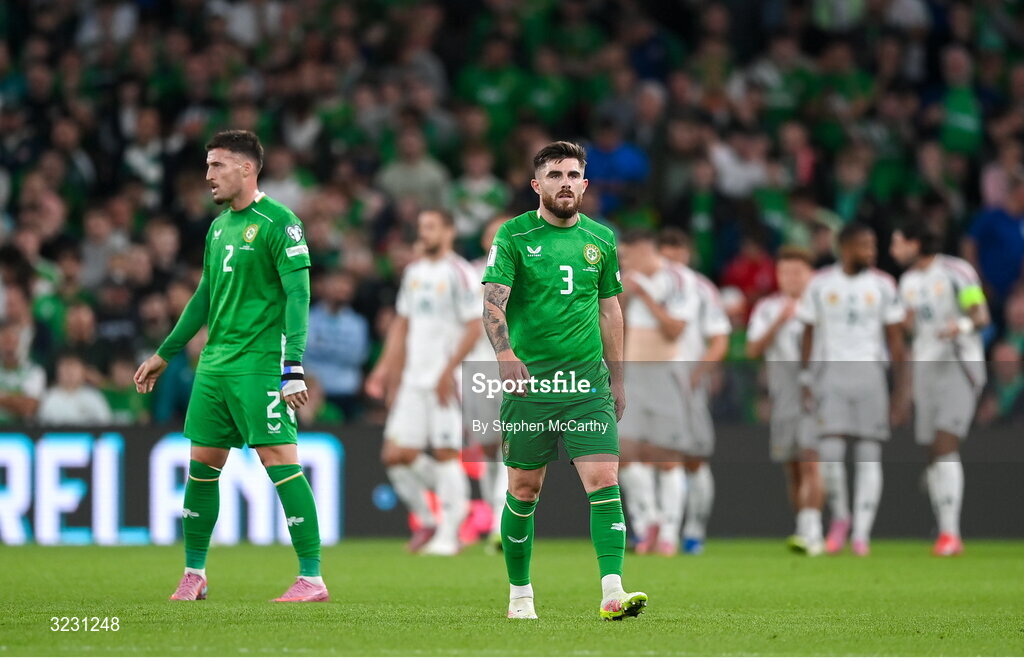 6 September 2025; Matt Doherty, left, and Ryan Manning of Republic of Ireland react as Hungary celebrate their second goal during the FIFA World Cup 2026 Group F qualifying match between Republic of Ireland and Hungary at the Aviva Stadium in Dublin. Photo by Stephen McCarthy/Sportsfile
