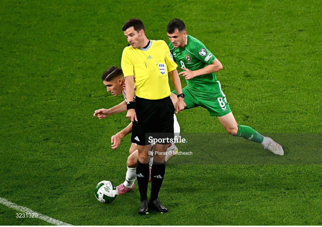 6 September 2025; Referee Harm Osmer moves out of the way of Roland Sallai of Hungary and Jason Knight of Republic of Ireland during the FIFA World Cup 2026 Group F qualifying match between Republic of Ireland and Hungary at the Aviva Stadium in Dublin. Photo by Piaras Ó Mídheach/Sportsfile