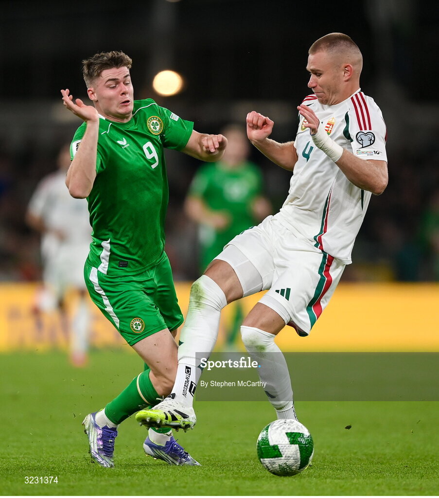 6 September 2025; Evan Ferguson of Republic of Ireland is tackled by Attila Szalai of Hungary during the FIFA World Cup 2026 Group F qualifying match between Republic of Ireland and Hungary at the Aviva Stadium in Dublin. Photo by Stephen McCarthy/Sportsfile