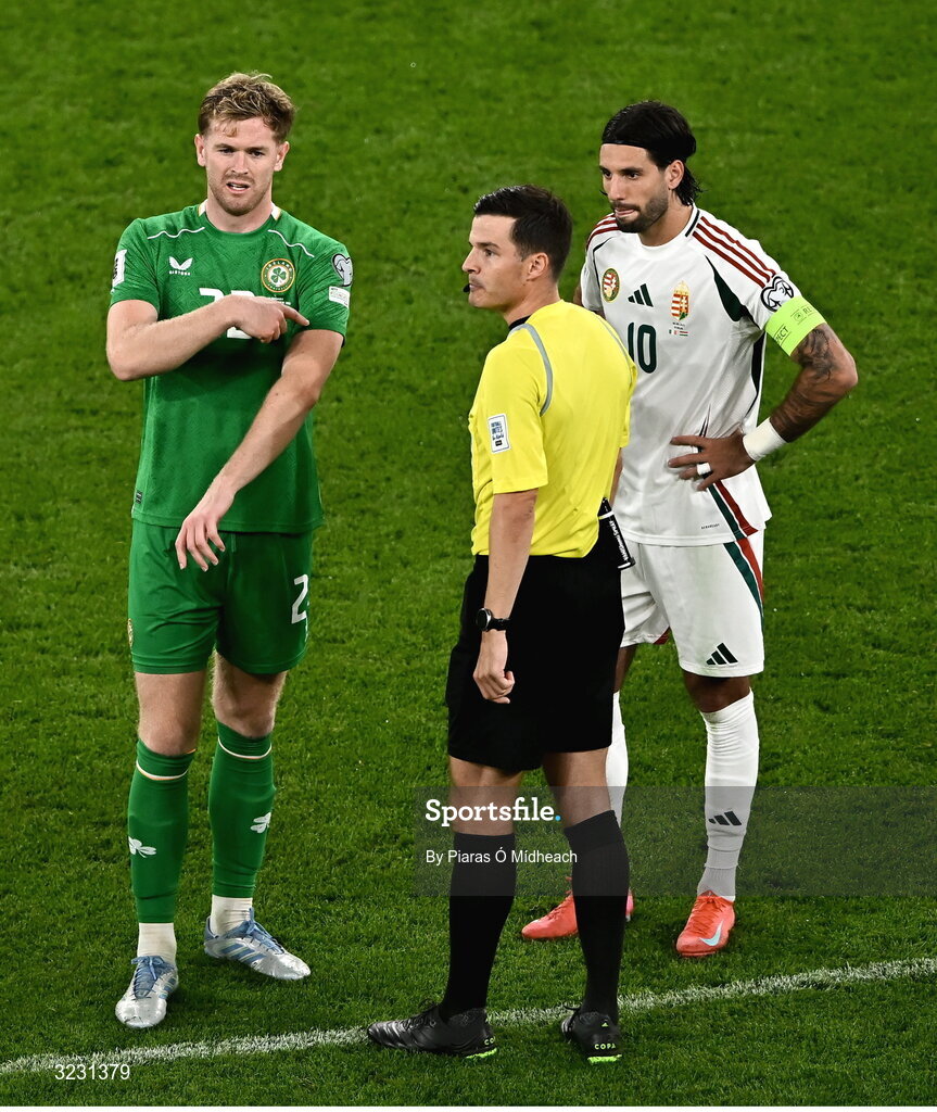 6 September 2025; Republic of Ireland captain Nathan Collins gestures to the bench for a captain's armband during the FIFA World Cup 2026 Group F qualifying match between Republic of Ireland and Hungary at the Aviva Stadium in Dublin. Photo by Piaras Ó Mídheach/Sportsfile
