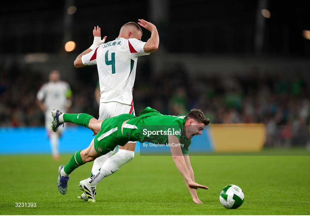 6 September 2025; Republic of Ireland is tackled by Attila Szalai of Hungary during the FIFA World Cup 2026 Group F qualifying match between Republic of Ireland and Hungary at the Aviva Stadium in Dublin. Photo by Stephen McCarthy/Sportsfile