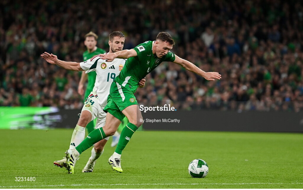 6 September 2025; Dara O'Shea of Republic of Ireland is tackled by Barnabás Varga of Hungary during the FIFA World Cup 2026 Group F qualifying match between Republic of Ireland and Hungary at the Aviva Stadium in Dublin. Photo by Stephen McCarthy/Sportsfile