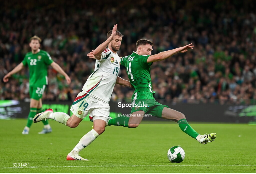 6 September 2025; Dara O'Shea of Republic of Ireland is tackled by Barnabás Varga of Hungary during the FIFA World Cup 2026 Group F qualifying match between Republic of Ireland and Hungary at the Aviva Stadium in Dublin. Photo by Stephen McCarthy/Sportsfile
