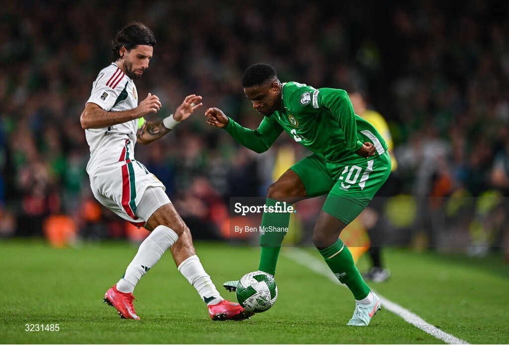 6 September 2025; Chiedozie Ogbene of Republic of Ireland is tackled by Dominik Szoboszlai of Hungary during the FIFA World Cup 2026 Group F qualifying match between Republic of Ireland and Hungary at the Aviva Stadium in Dublin. Photo by Ben McShane/Sportsfile