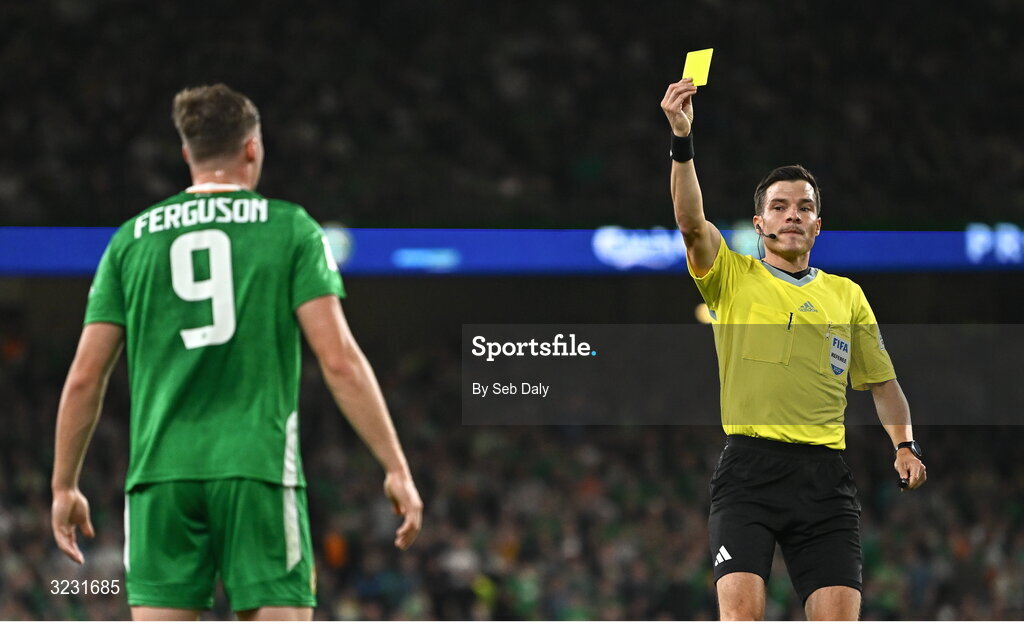 6 September 2025; Referee Harm Osmer shows a yellow card to Evan Ferguson of Republic of Ireland during the FIFA World Cup 2026 Group F qualifying match between Republic of Ireland and Hungary at the Aviva Stadium in Dublin. Photo by Seb Daly/Sportsfile
