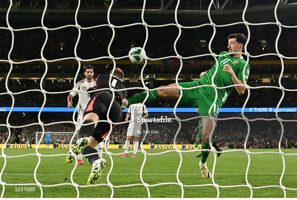 6 September 2025; Finn Azaz of Republic of Ireland in action against Hungary goalkeeper Dénes Dibusz during the FIFA World Cup 2026 Group F qualifying match between Republic of Ireland and Hungary at the Aviva Stadium in Dublin. Photo by Seb Daly/Sportsfile