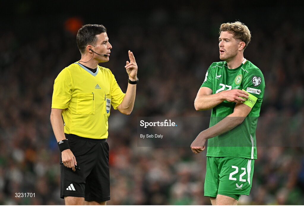 6 September 2025; Referee Harm Osmer and Nathan Collins of Republic of Ireland during the FIFA World Cup 2026 Group F qualifying match between Republic of Ireland and Hungary at the Aviva Stadium in Dublin. Photo by Seb Daly/Sportsfile