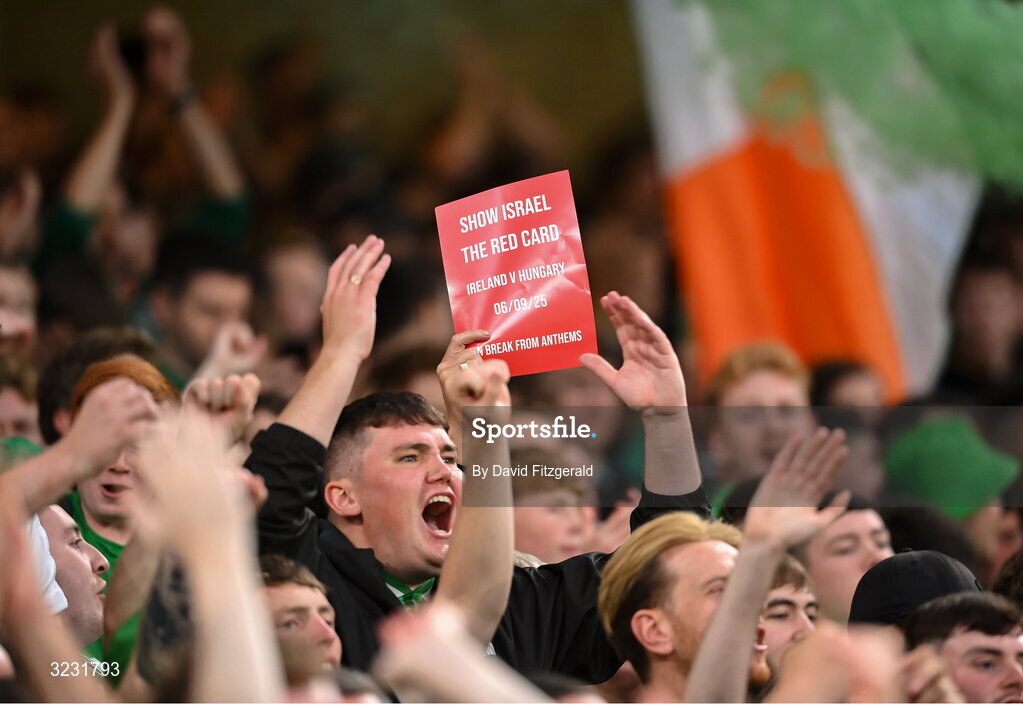 6 September 2025; Republic of Ireland hold up a red card saying 'Show Israel the Red Card' during the FIFA World Cup 2026 Group F qualifying match between Republic of Ireland and Hungary at the Aviva Stadium in Dublin. Photo by David Fitzgerald/Sportsfile
