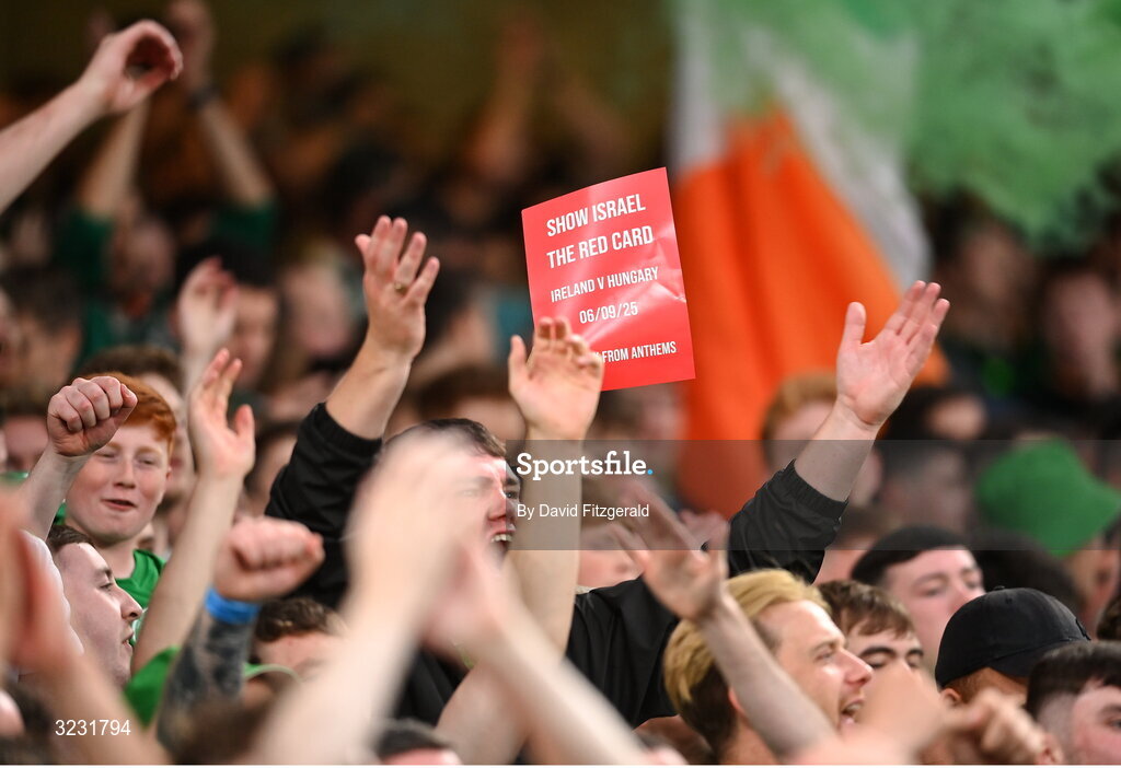 6 September 2025; Republic of Ireland hold up a red card saying 'Show Israel the Red Card' during the FIFA World Cup 2026 Group F qualifying match between Republic of Ireland and Hungary at the Aviva Stadium in Dublin. Photo by David Fitzgerald/Sportsfile