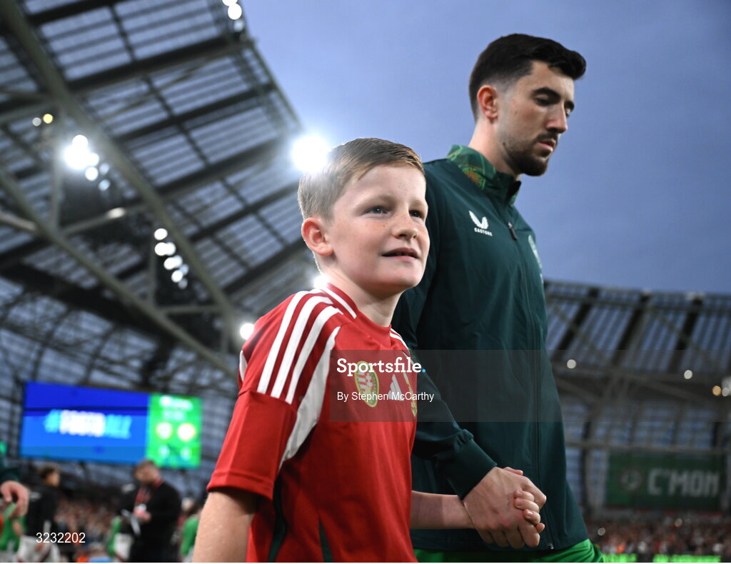 6 September 2025; Finn Azaz of Republic of Ireland and his mascot walk out for the FIFA World Cup 2026 Group F qualifying match between Republic of Ireland and Hungary at the Aviva Stadium in Dublin. Photo by Stephen McCarthy/Sportsfile