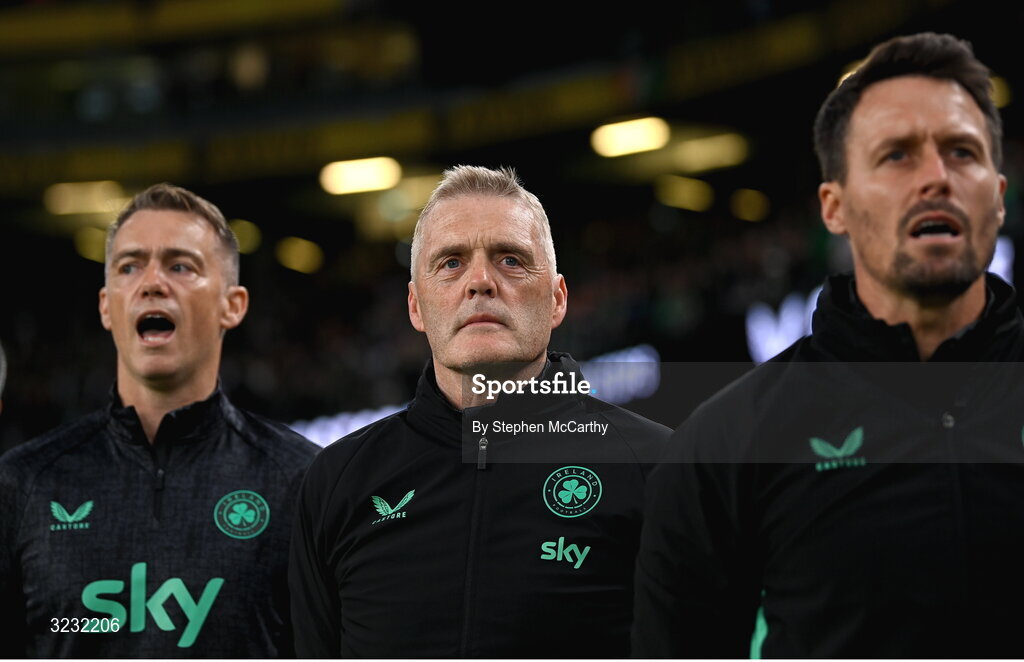 6 September 2025; Republic of Ireland goalkeeping coach Gudmundur Hreidarsson, centre, assistant coach Paddy McCarthy, right, and head of athletic performance Damien Doyle, left, stand for the playing of the National Anthem  before the FIFA World Cup 2026 Group F qualifying match between Republic of Ireland and Hungary at the Aviva Stadium in Dublin. Photo by Stephen McCarthy/Sportsfile