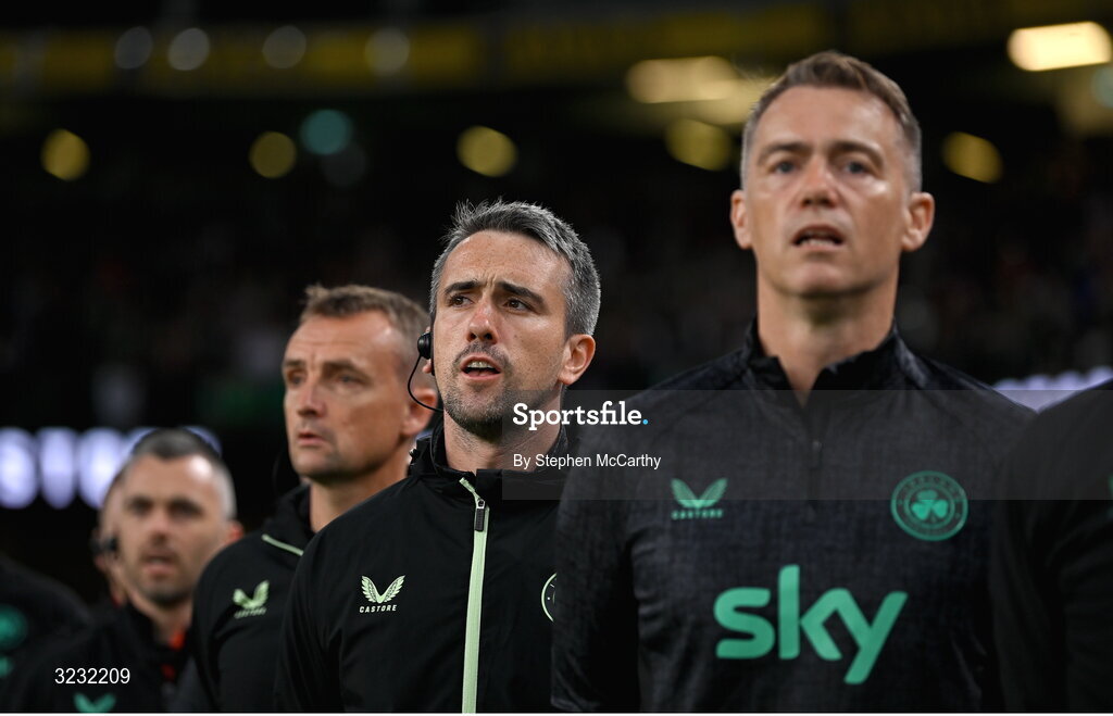 6 September 2025; Republic of Ireland team doctor Sean Carmody and head of athletic performance Damien Doyle, right, stand for the playing of the National Anthem before the FIFA World Cup 2026 Group F qualifying match between Republic of Ireland and Hungary at the Aviva Stadium in Dublin. Photo by Stephen McCarthy/Sportsfile