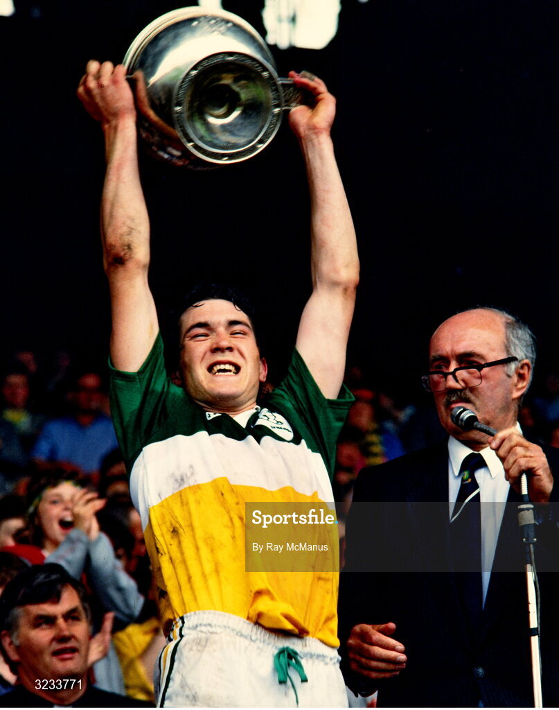 13 July 1986; Offaly captain Michael Hogan lifts the Hanrahan Cup alongside Leinster Council Chairman Peadar O Cearnaigh after his sides victory in the Leinster Minor Hurling Championship Final match between Offaly and Wexford at Croke Park, Dublin. Photo by Ray McManus/Sportsfile