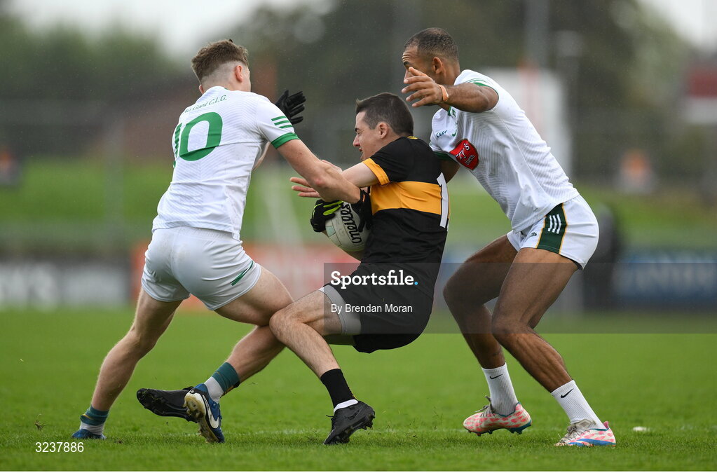 14 September 2025; Brian Looney of Dr Crokes is tackled by Tomas O'Hainifein, left, and Stefan Okunbor of Na Gaeil during the Kerry County Senior Club Football Championship final match between Dr Crokes and Na Gaeil at Austin Stack Park in Tralee, Kerry. Photo by Brendan Moran/Sportsfile