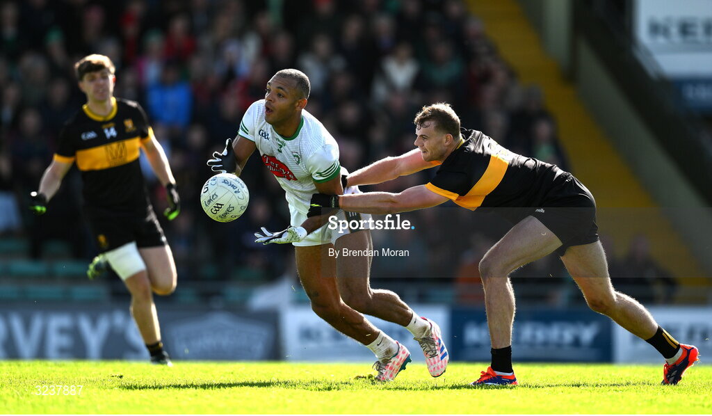 14 September 2025; Stefan Okunbor of Na Gaeil is tackled by Mark O'Shea of Dr Crokes during the Kerry County Senior Club Football Championship final match between Dr Crokes and Na Gaeil at Austin Stack Park in Tralee, Kerry. Photo by Brendan Moran/Sportsfile
