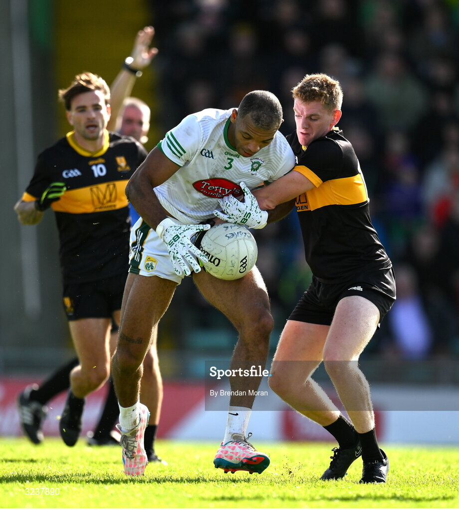 14 September 2025; Stefan Okunbor of Na Gaeil is tackled by Cian McMahon of Dr Crokes during the Kerry County Senior Club Football Championship final match between Dr Crokes and Na Gaeil at Austin Stack Park in Tralee, Kerry. Photo by Brendan Moran/Sportsfile