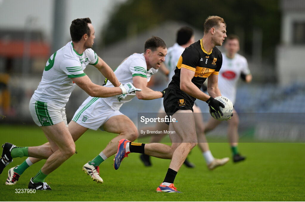 14 September 2025; Mark O'Shea of Dr Crokes in action against Eoin Doody, left, and Jack Barry of Na Gaeil during the Kerry County Senior Club Football Championship final match between Dr Crokes and Na Gaeil at Austin Stack Park in Tralee, Kerry. Photo by Brendan Moran/Sportsfile