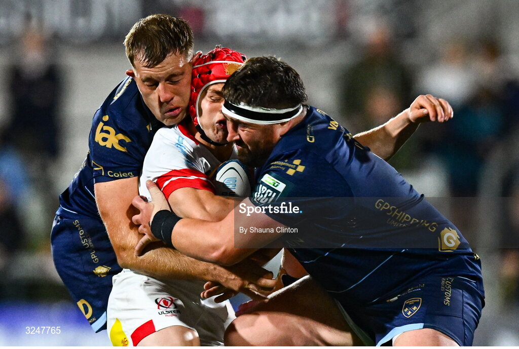26 September 2025; Michael Lowry of Ulster is tackled by Dragons players Ben Carter, left, and Wyn Jones during the United Rugby Championship match between Ulster and Dragons at Affidea Stadium in Belfast. Photo by Shauna Clinton/Sportsfile