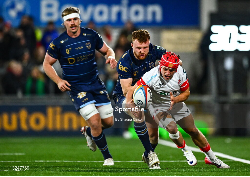 26 September 2025; Michael Lowry of Ulster is tackled by Aneurin Owen of Dragons during the United Rugby Championship match between Ulster and Dragons at Affidea Stadium in Belfast. Photo by Shauna Clinton/Sportsfile