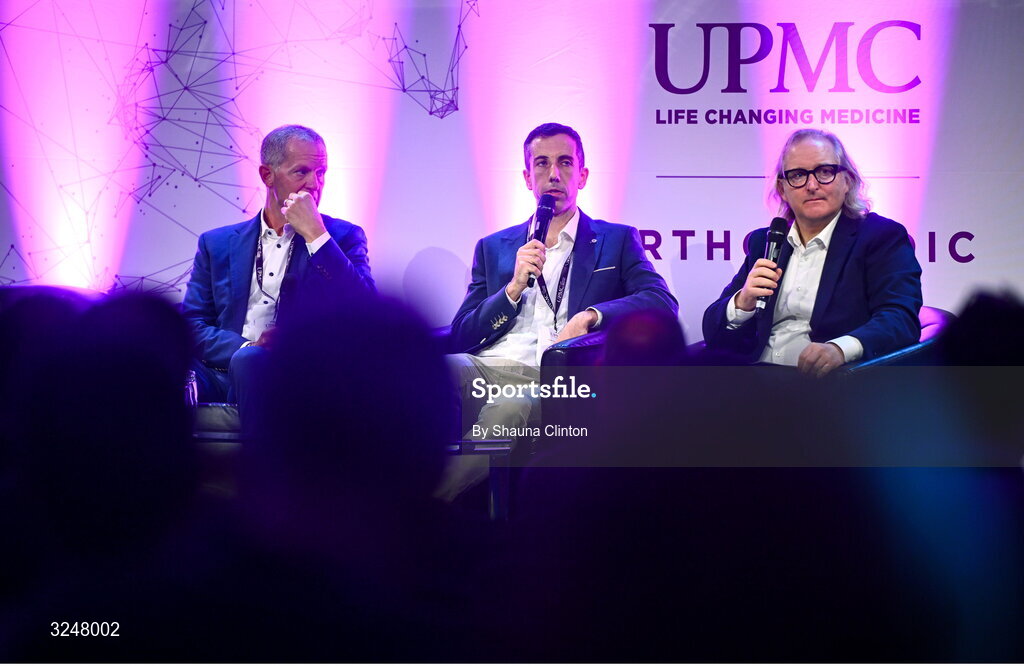 27 September 2025; Attendees, from left, UPMC Concussion Program director Michael Collins PhD, UPMC Concussion Clinical Specialist John Courell and MC Ger Gilroy, Newstalk Radio, during the UPMC Orthopaedic Care and Sports Medicine Conference at The Convention Centre in Dublin. Photo by Shauna Clinton/Sportsfile