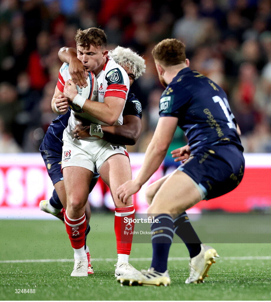 26 September 2025; Jack Murphy of Ulster is tackled by Fine Inisi of Dragons during the United Rugby Championship match between Ulster and Dragons at Affidea Stadium in Belfast. Photo by John Dickson/Sportsfile