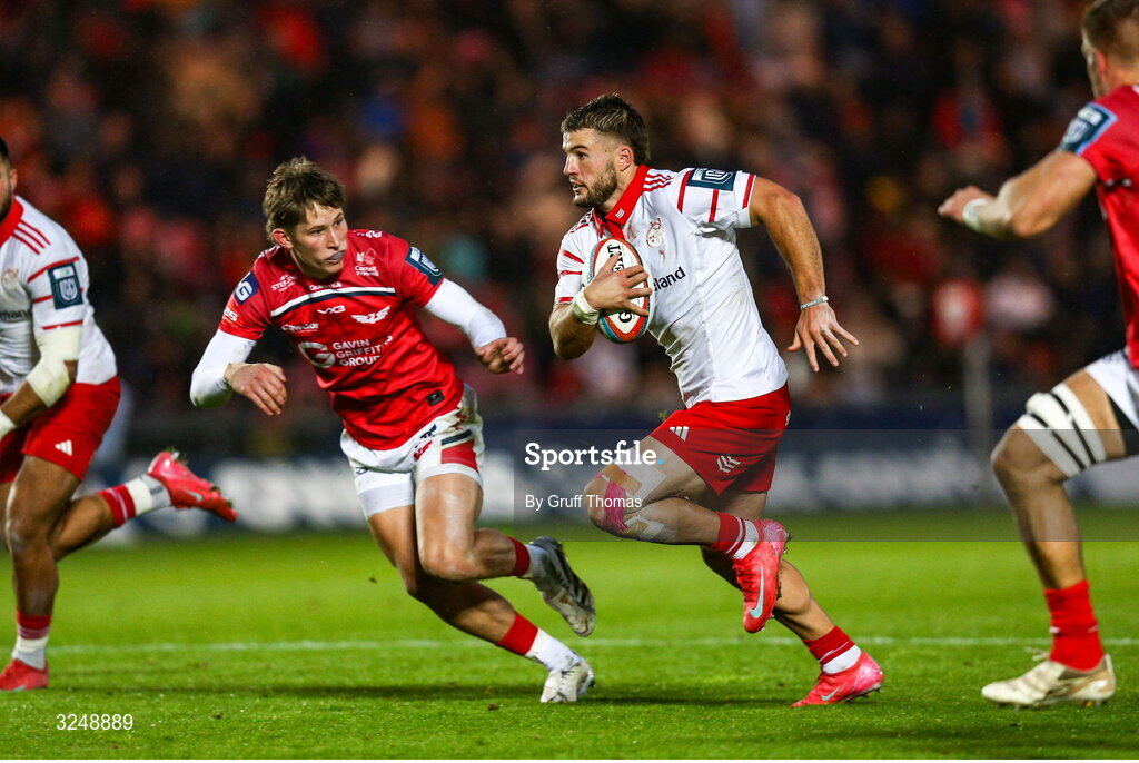 27 September 2025; Alex Nankivell of Munster makes a break during the United Rugby Championship match between Scarlets and Munster at Parc Y Scarlets in Llanelli, Wales. Photo by Gruff Thomas/Sportsfile
