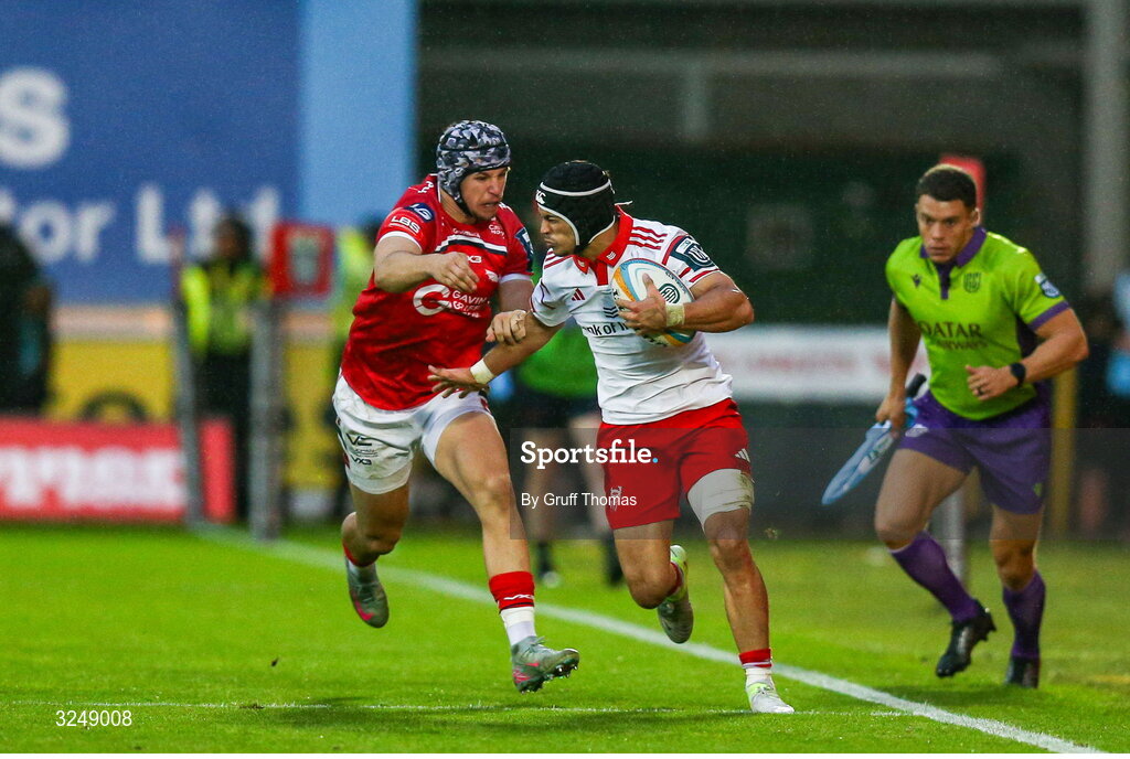 27 September 2025; Thaakir Abrahams of Munster is tackled by Tom Rogers of Scarlets during the United Rugby Championship match between Scarlets and Munster at Parc Y Scarlets in Llanelli, Wales. Photo by Gruff Thomas/Sportsfile