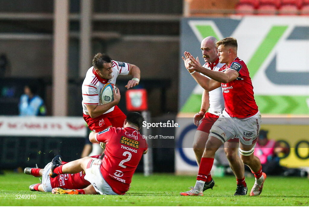 27 September 2025; Brian Gleeson of Munster is tackled by Harry Thomas of Scarlets during the United Rugby Championship match between Scarlets and Munster at Parc Y Scarlets in Llanelli, Wales. Photo by Gruff Thomas/Sportsfile