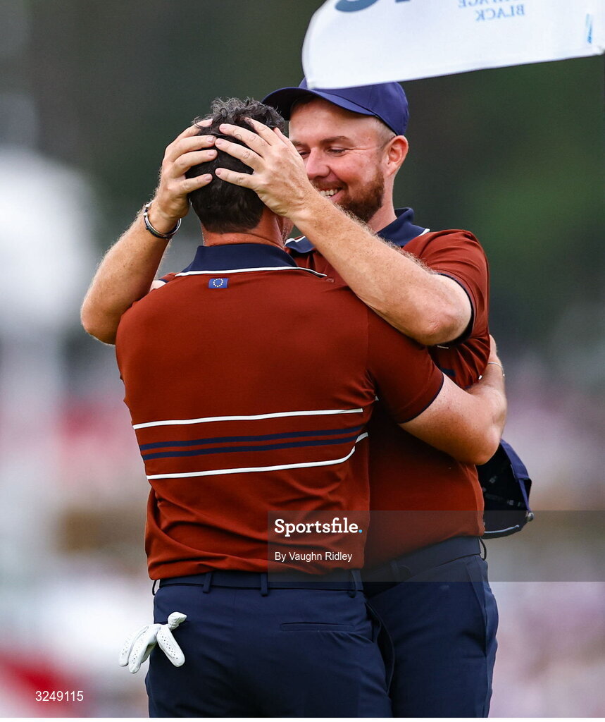 27 September 2025; Rory McIlroy of Europe, left, and Shane Lowry of Europe celebrate on the 18th green after winning in the afternoon fourballs on day two of the 2025 Ryder Cup at Black Course at Bethpage State Park Golf Course in Farmingdale, New York, USA. Photo by Vaughn Ridley/Sportsfile