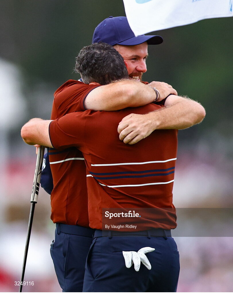 27 September 2025; Rory McIlroy of Europe, left, and Shane Lowry of Europe celebrate on the 18th green after winning in the afternoon fourballs on day two of the 2025 Ryder Cup at Black Course at Bethpage State Park Golf Course in Farmingdale, New York, USA. Photo by Vaughn Ridley/Sportsfile