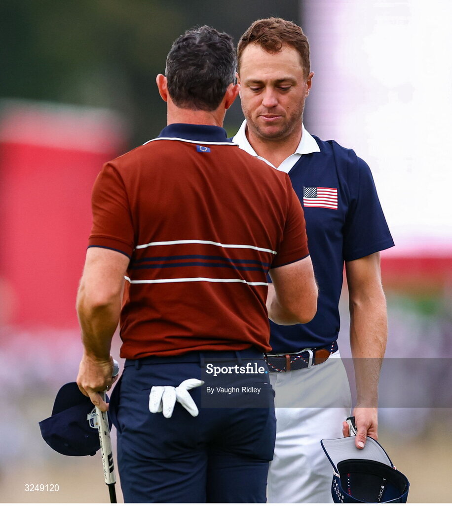 27 September 2025; Rory McIlroy of Europe and Justin Thomas of USA embrace after the afternoon fourballs on day two of the 2025 Ryder Cup at Black Course at Bethpage State Park Golf Course in Farmingdale, New York, USA. Photo by Vaughn Ridley/Sportsfile