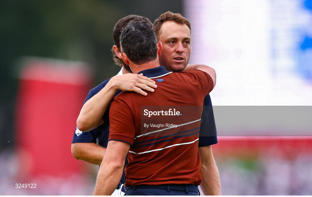 27 September 2025; Rory McIlroy of Europe and Justin Thomas of USA embrace after the afternoon fourballs on day two of the 2025 Ryder Cup at Black Course at Bethpage State Park Golf Course in Farmingdale, New York, USA. Photo by Vaughn Ridley/Sportsfile