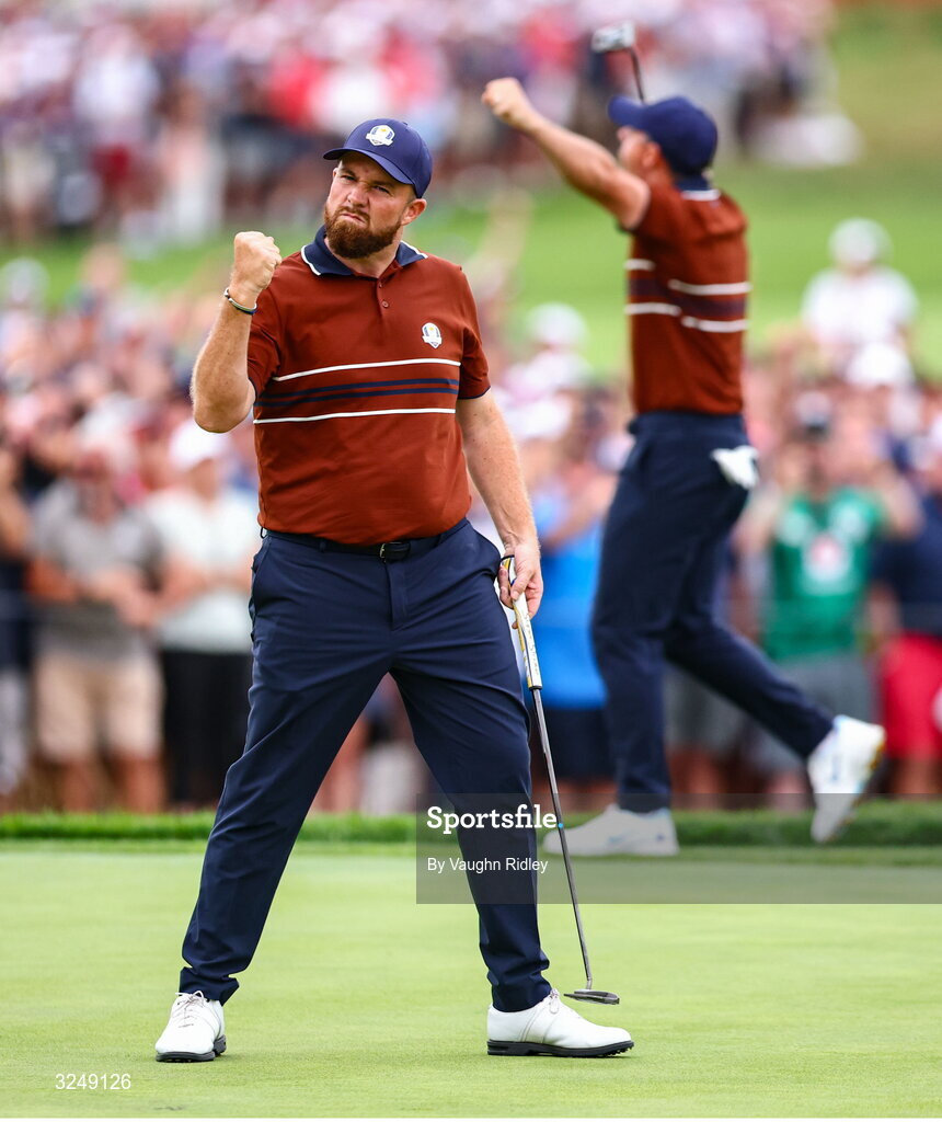 27 September 2025; Shane Lowry of Europe, left, and Rory McIlroy of Europe celebrate on the 17th green during the afternoon fourballs on day two of the 2025 Ryder Cup at Black Course at Bethpage State Park Golf Course in Farmingdale, New York, USA. Photo by Vaughn Ridley/Sportsfile