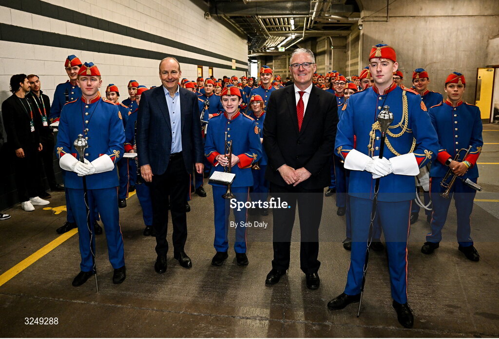 28 September 2025; An Taoiseach Michéal Martin TD and Uachtarán Chumann Lúthchleas Gael Jarlath Burns with The Artane Band before the 2025 NFL International Game between the Pittsburgh Steelers and the Minnesota Vikings at Croke Park in Dublin. Photo by Seb Daly/Sportsfile