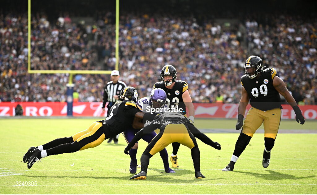 28 September 2025; Minnesota Vikings wide receiver Justin Jefferson #18 is tackled by Cornerback Jalen Ramsey, left, and Juan Thornhill #22 of Pittsburgh Steelers during the 2025 NFL International Game between the Pittsburgh Steelers and the Minnesota Vikings at Croke Park in Dublin. Photo by Seb Daly/Sportsfile