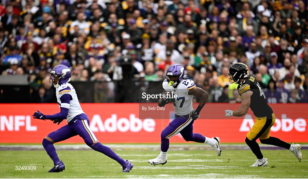 28 September 2025; Running back Jordan Mason #27 of Minnesota Vikings in action against Linebacker Payton Wilson #41 of Pittsburgh Steelers during the 2025 NFL International Game between the Pittsburgh Steelers and the Minnesota Vikings at Croke Park in Dublin. Photo by Seb Daly/Sportsfile