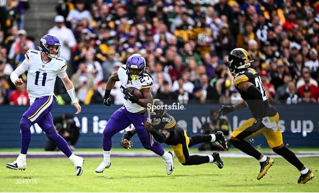 28 September 2025; Running back Jordan Mason #27 of Minnesota Vikings is tackled by Cornerback Jalen Ramsey #5 of Pittsburgh Steelers during the 2025 NFL International Game between the Pittsburgh Steelers and the Minnesota Vikings at Croke Park in Dublin. Photo by Seb Daly/Sportsfile