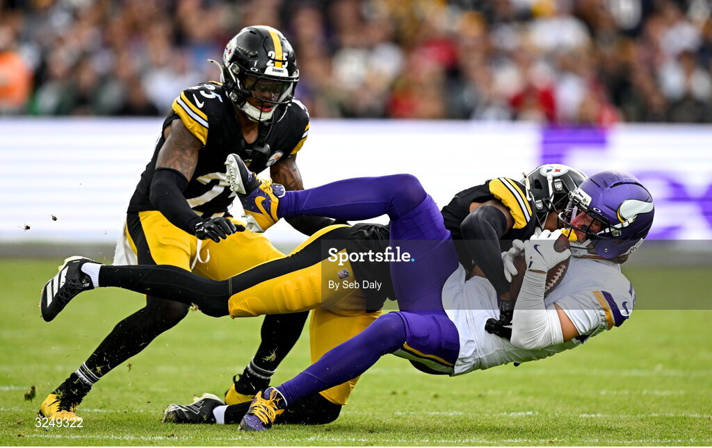 28 September 2025; Wide receiver Adam Thielen #19 of Minnesota Vikings is tackled by Cornerback Brandin Echols #26 of Pittsburgh Steelers during the 2025 NFL International Game between the Pittsburgh Steelers and the Minnesota Vikings at Croke Park in Dublin. Photo by Seb Daly/Sportsfile