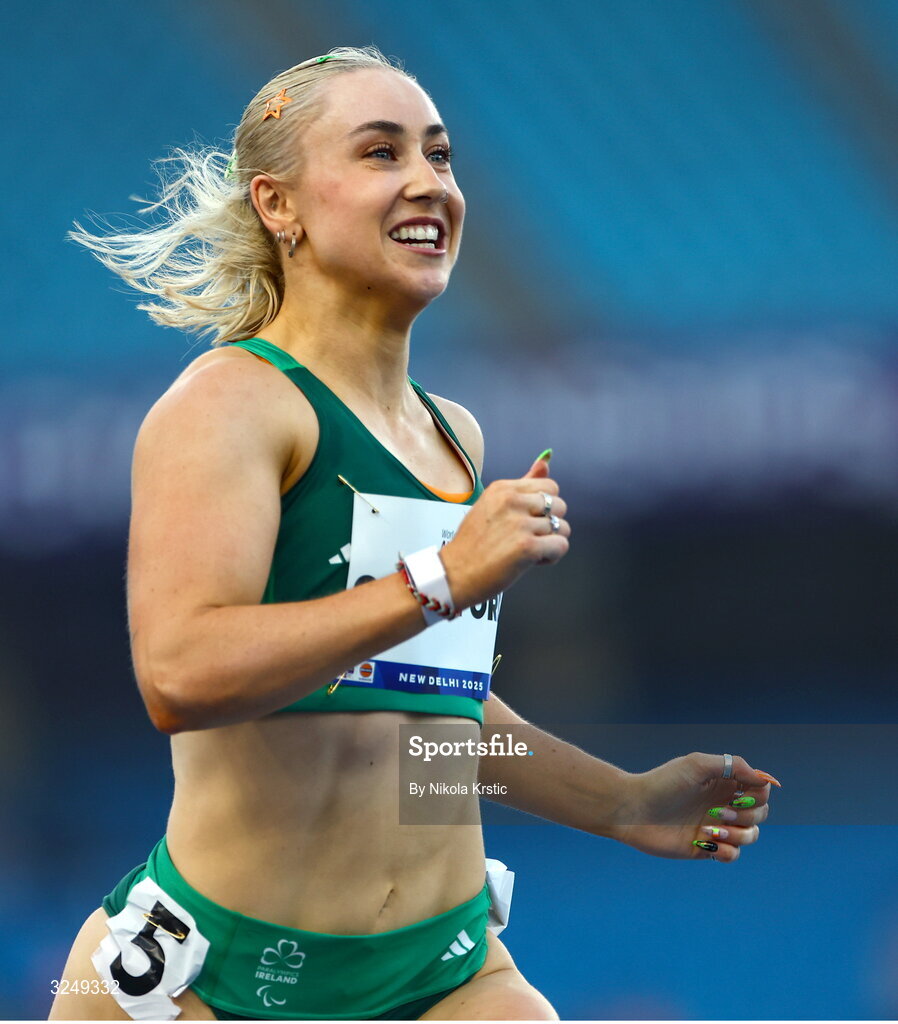 28 September 2025; Orla Comerford of team Ireland celebrates after winning Gold in the Women's T13 100m final during day three of the New Delhi 2025 World Para Athletics Championships at JLN Stadium in New Delhi, India. Photo by Nikola Krstic/Sportsfile