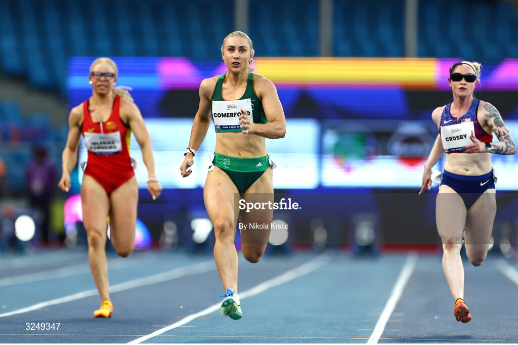 28 September 2025; Orla Comerford of team Ireland on her way to winning Gold in the Women's T13 100m final during day three of the New Delhi 2025 World Para Athletics Championships at JLN Stadium in New Delhi, India. Photo by Nikola Krstic/Sportsfile