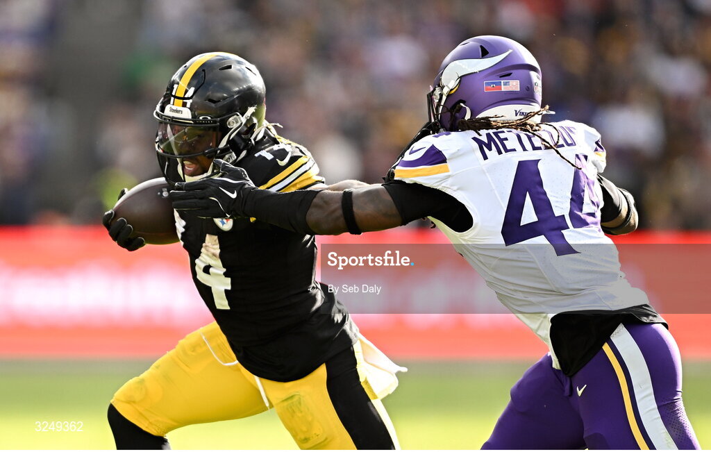 28 September 2025; Running back Kenneth Gainwell #14 of Pittsburgh Steelers is tackled by Safety Joshua Metellus #44 of Minnesota Vikings during the 2025 NFL International Game between the Pittsburgh Steelers and the Minnesota Vikings at Croke Park in Dublin. Photo by Seb Daly/Sportsfile