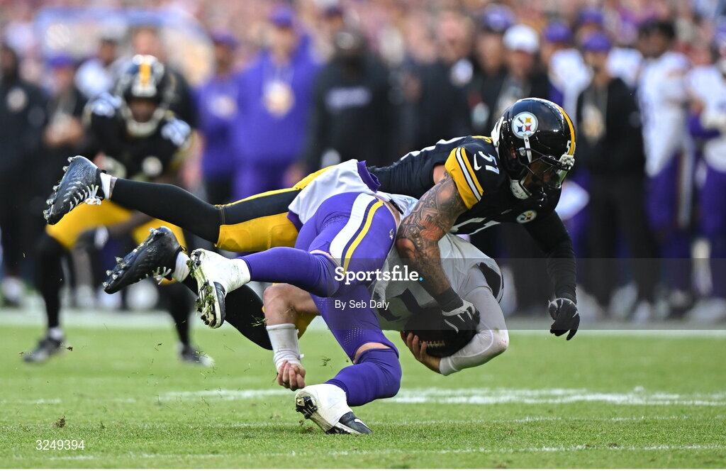 28 September 2025; Quarterback Carson Wentz #11 of Minnesota Vikings is tackled by Linebacker Nick Herbig #51 of Pittsburgh Steelers during the 2025 NFL International Game between the Pittsburgh Steelers and the Minnesota Vikings at Croke Park in Dublin. Photo by Seb Daly/Sportsfile