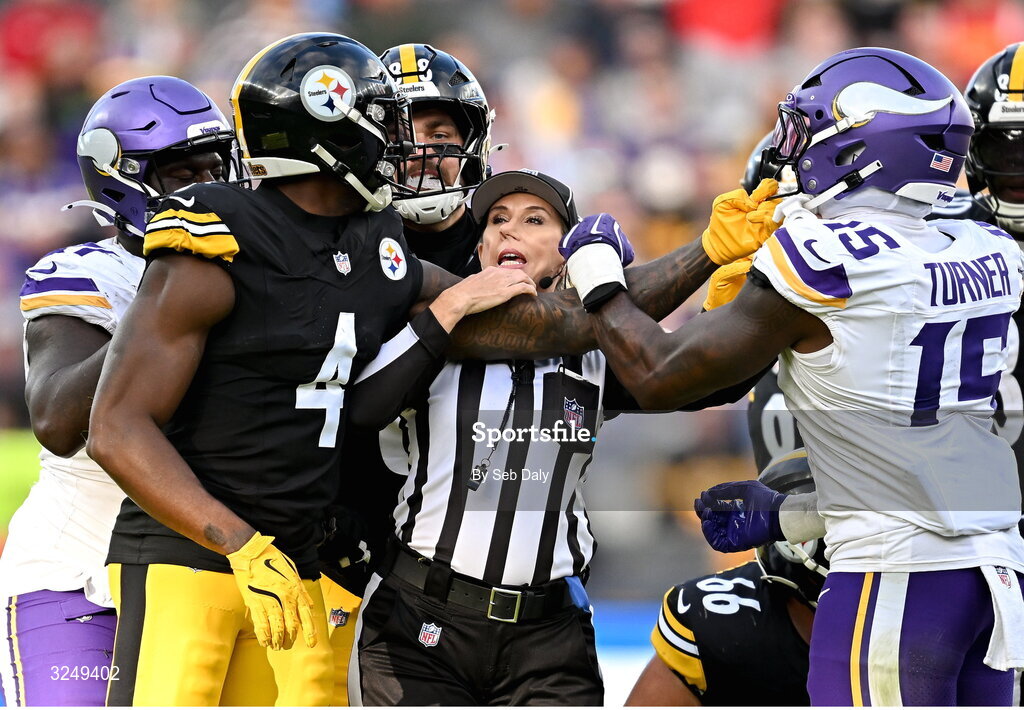 28 September 2025; Down judge Sarah Thomas seperates Wide receiver DK Metcalf #4 of Pittsburgh Steelers and Offensive linebacker Dallas Turner #15 of Minnesota Vikings during the 2025 NFL International Game between the Pittsburgh Steelers and the Minnesota Vikings at Croke Park in Dublin. Photo by Seb Daly/Sportsfile
