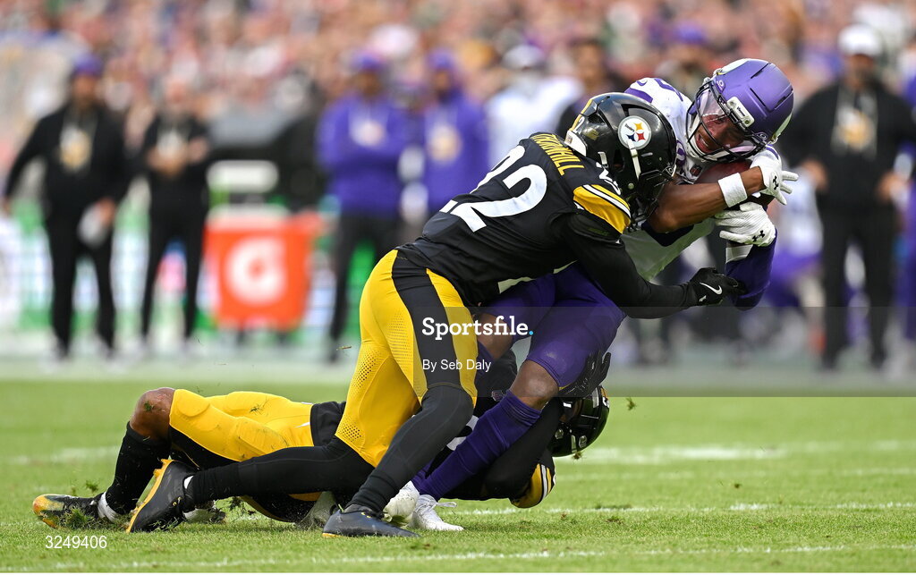 28 September 2025; Wide receiver Justin Jefferson #18 of Minnesota Vikings is tackled by Safety Juan Thornhill #22, left, and Cornerback Darius Slay #23 of Pittsburgh Steelers during the 2025 NFL International Game between the Pittsburgh Steelers and the Minnesota Vikings at Croke Park in Dublin. Photo by Seb Daly/Sportsfile