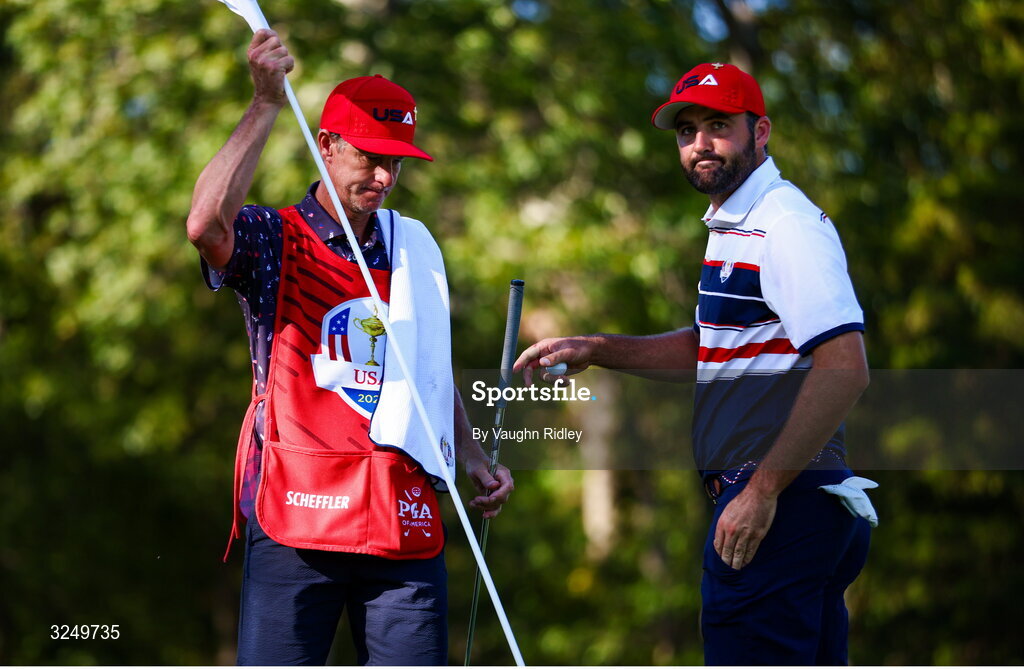 28 September 2025; Scottie Scheffler of USA and his caddie Ted Scott during the singles matches on day three of the 2025 Ryder Cup at Black Course at Bethpage State Park Golf Course in Farmingdale, New York, USA. Photo by Vaughn Ridley/Sportsfile