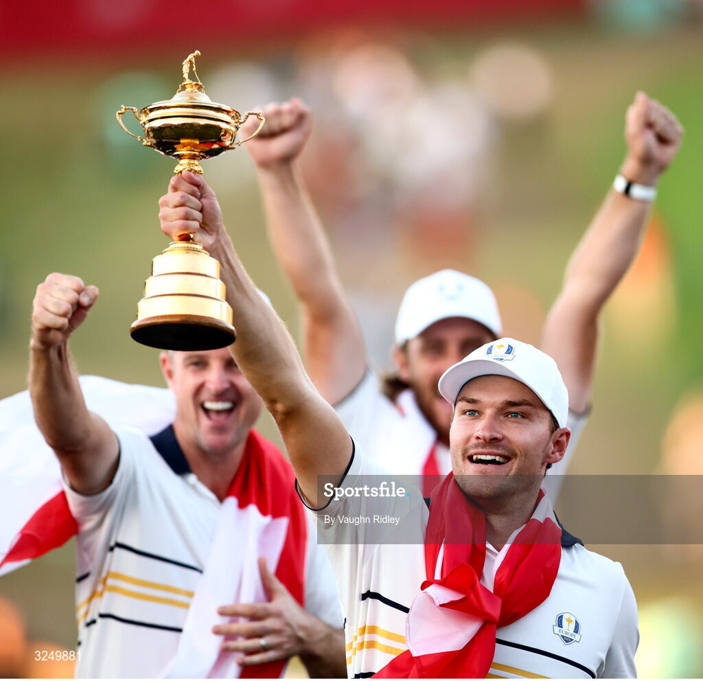 28 September 2025; Rasmus Hojgaard of Team Europe lifts the Ryder Cup on day three of the 2025 Ryder Cup at Black Course at Bethpage State Park Golf Course in Farmingdale, New York, USA. Photo by Vaughn Ridley/Sportsfile