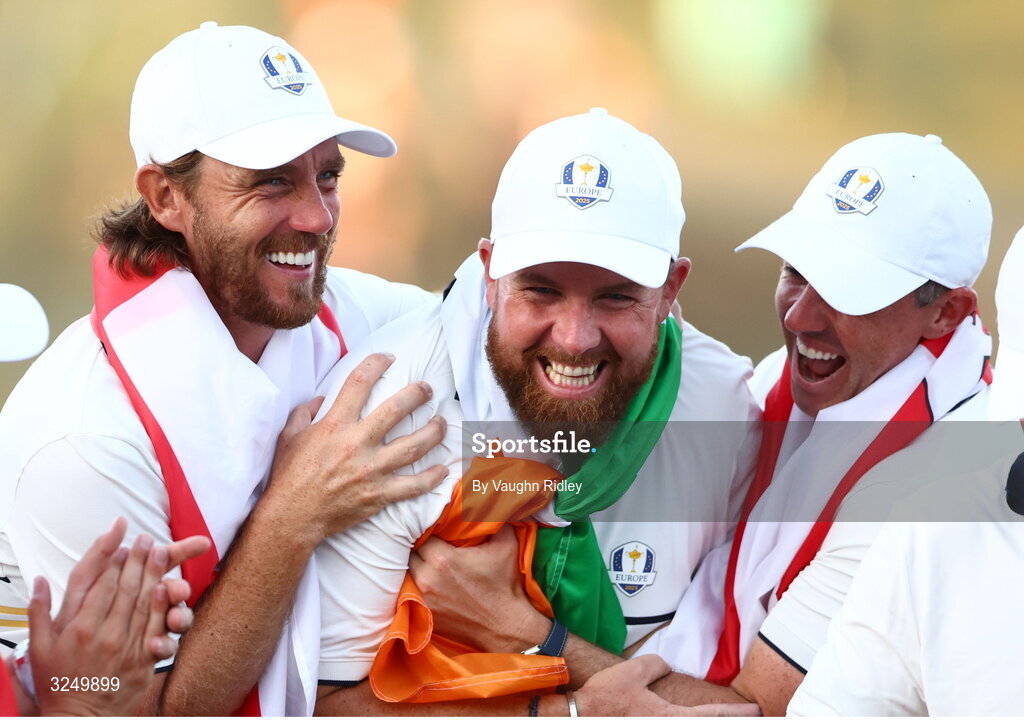 28 September 2025; Shane Lowry of Europe celebrates with teammates Tommy Fleetwood, left, and Rory McIlroy on day three of the 2025 Ryder Cup at Black Course at Bethpage State Park Golf Course in Farmingdale, New York, USA. Photo by Vaughn Ridley/Sportsfile